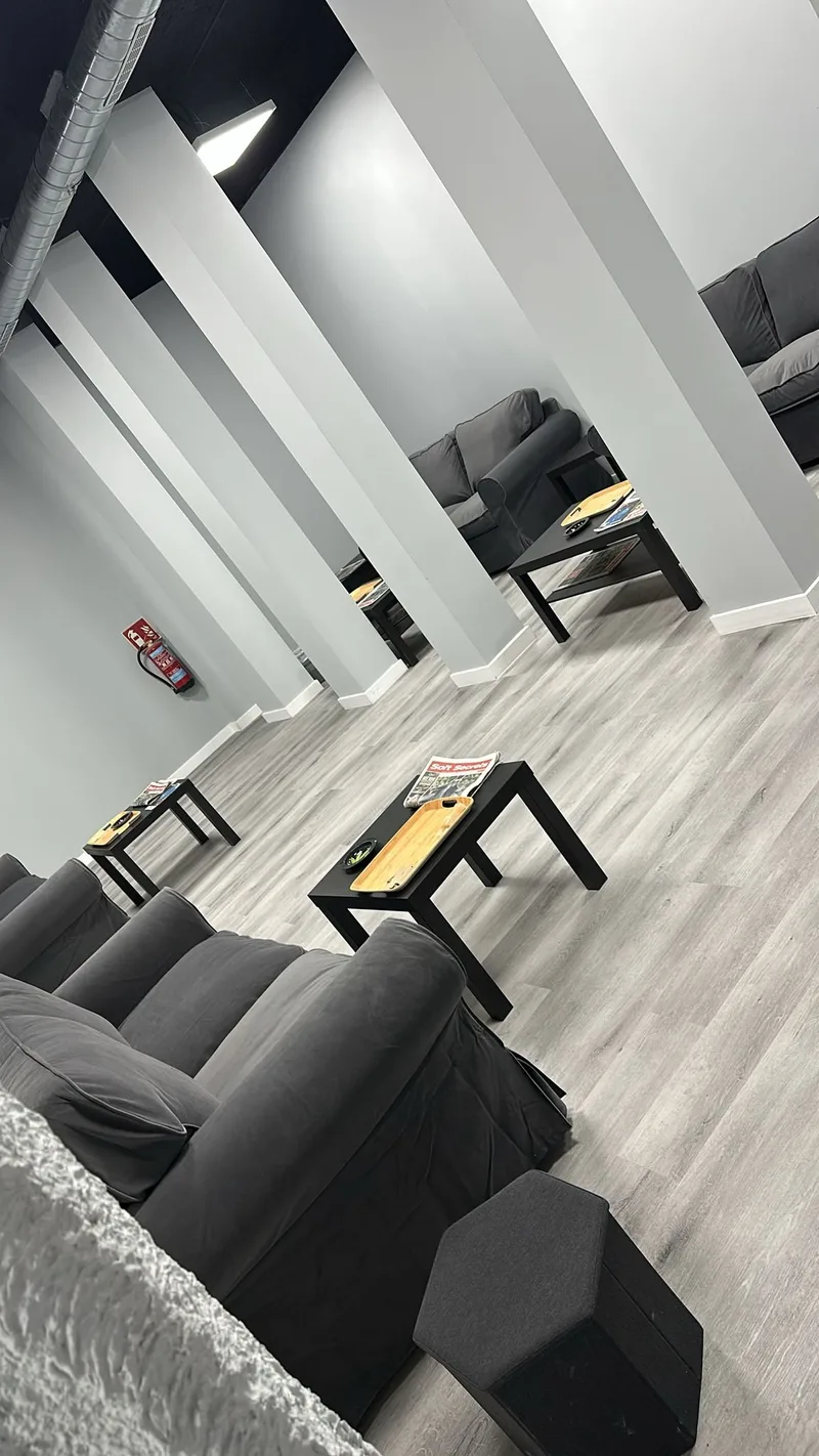 Bio Hazard Madrid cannabis club interior lounge area with ambient lighting and comfortable seating